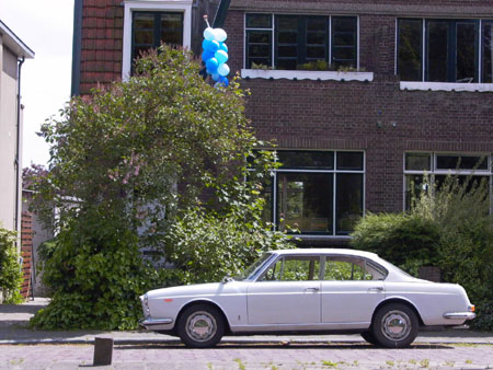 Lancia Quattroporte: “This Flavia Berlina Pininfarina fake is made from this photo of my Flavia in front of our house. The picture was shot when our son was just born, hence the baloons.”